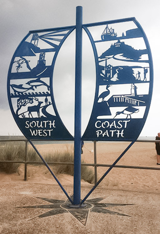 South West Coast PAth sculpture - blu cut-out metal sheet resembling a sail